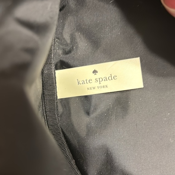 Kate Spade 11” clutch NWT. The only flaw is a small water mark under plastic. - Picture 14 of 16